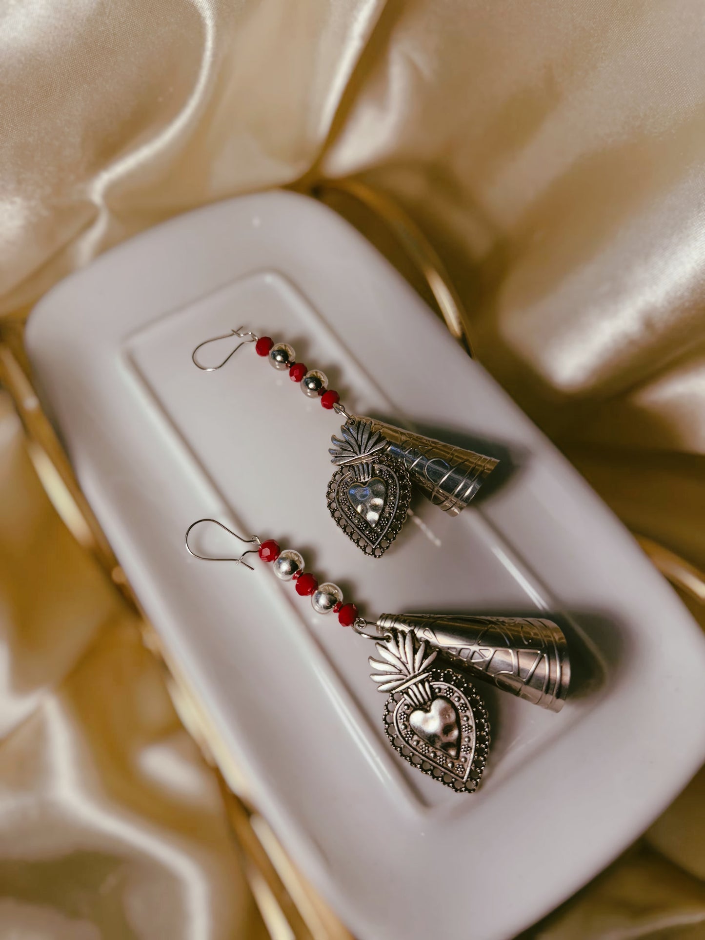 One off set • Nickel plated jingle cone earrings with metal sacred heart charms