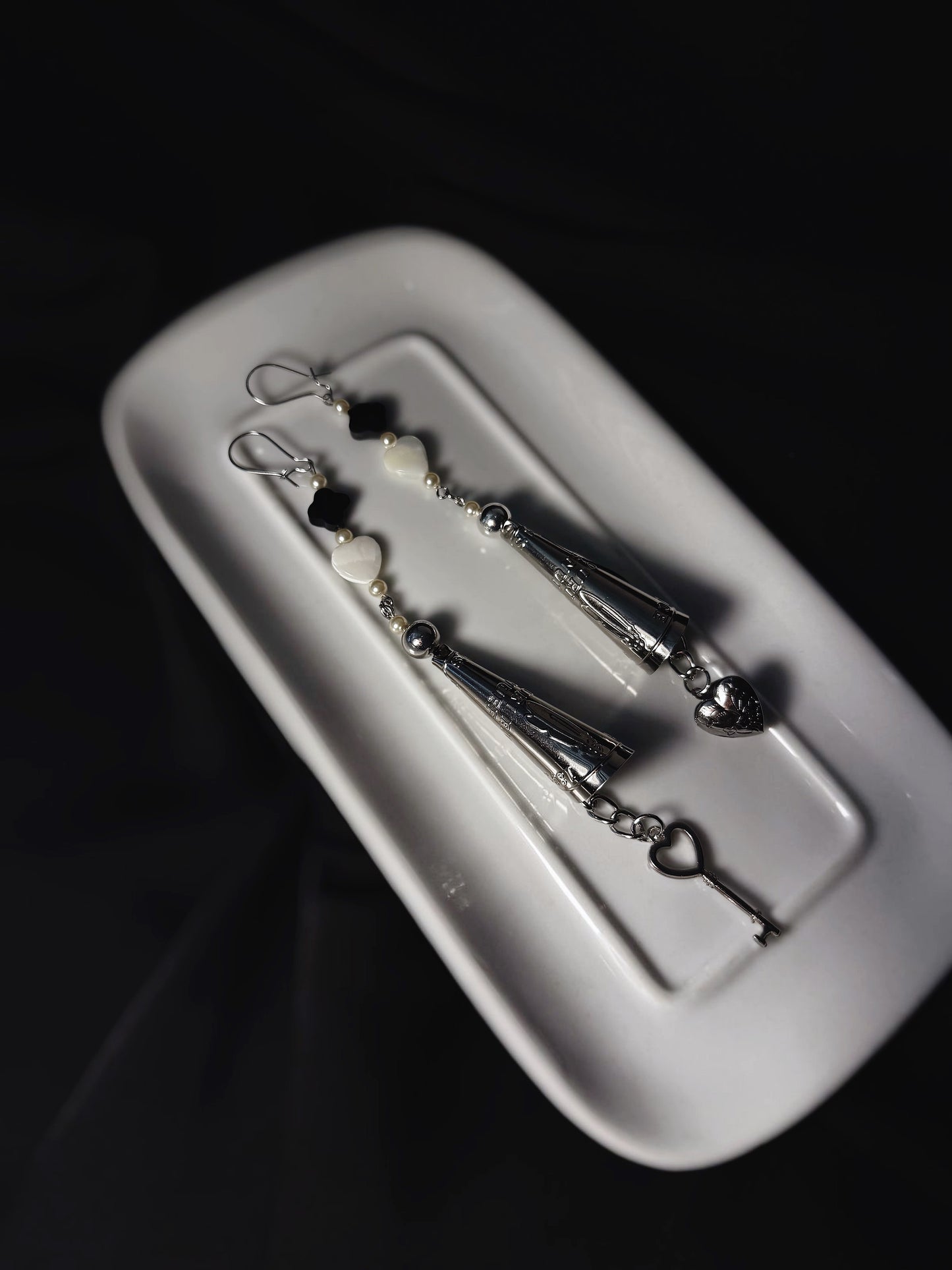 A one of a kind set adorned with black onyx, complete with a key and heart locket charm