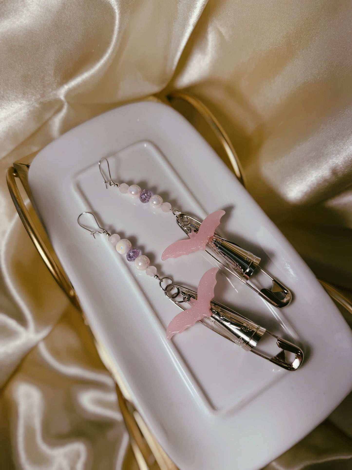 One off set • It’s BATZ safety pin jingle earrings
